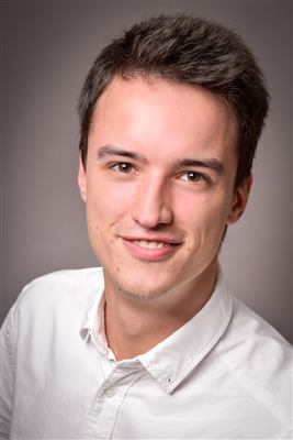 Portrait of Lukas Ben Mangel in a white shirt